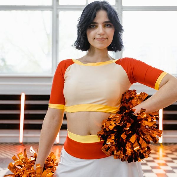Person feeling energetic with vibrant orange light highlights.